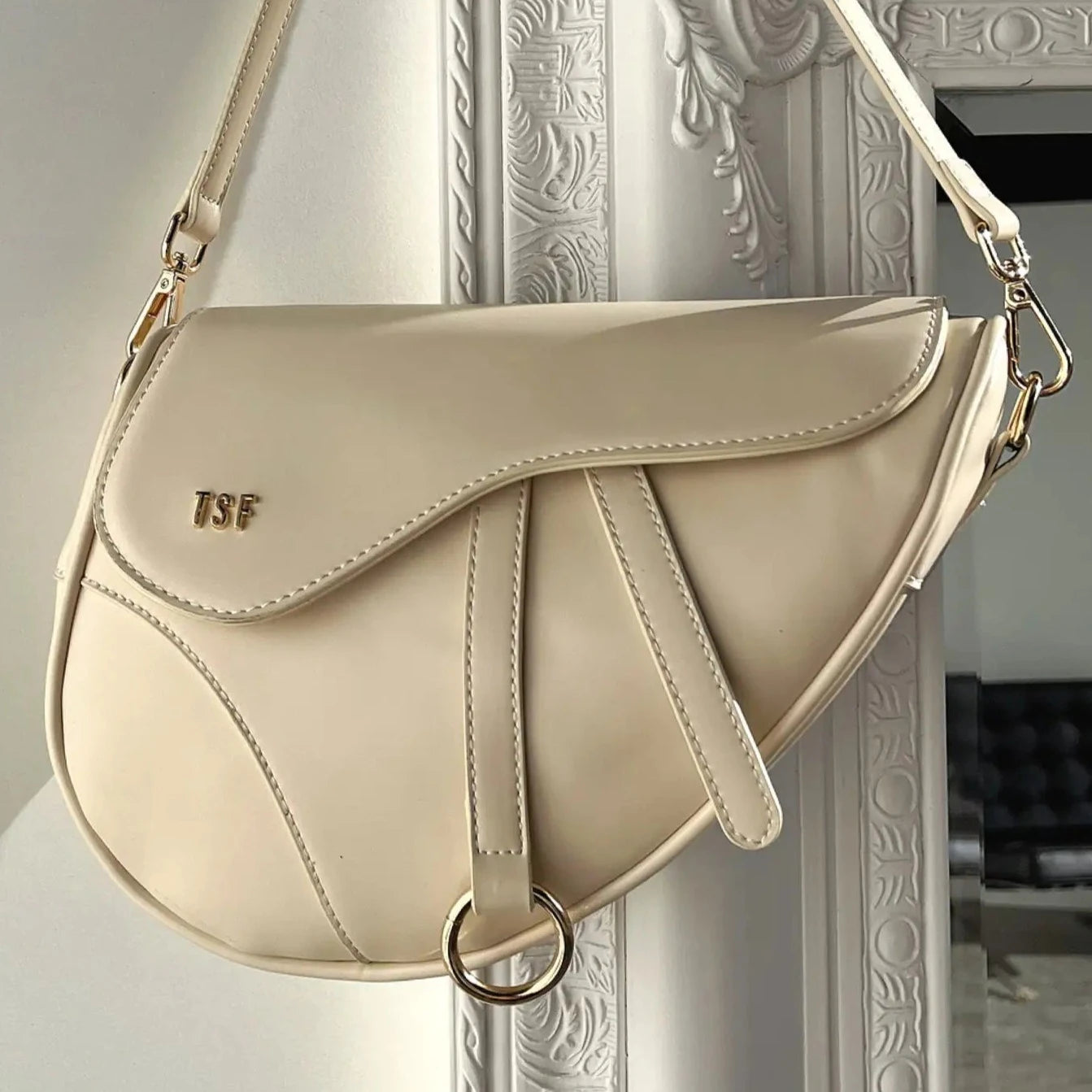 Sophisticated Saddle-Shaped Shoulder Bag with Gold Accents